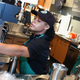 A Starbucks employees readies a beverage for a customer in a New York City store in 2003.
